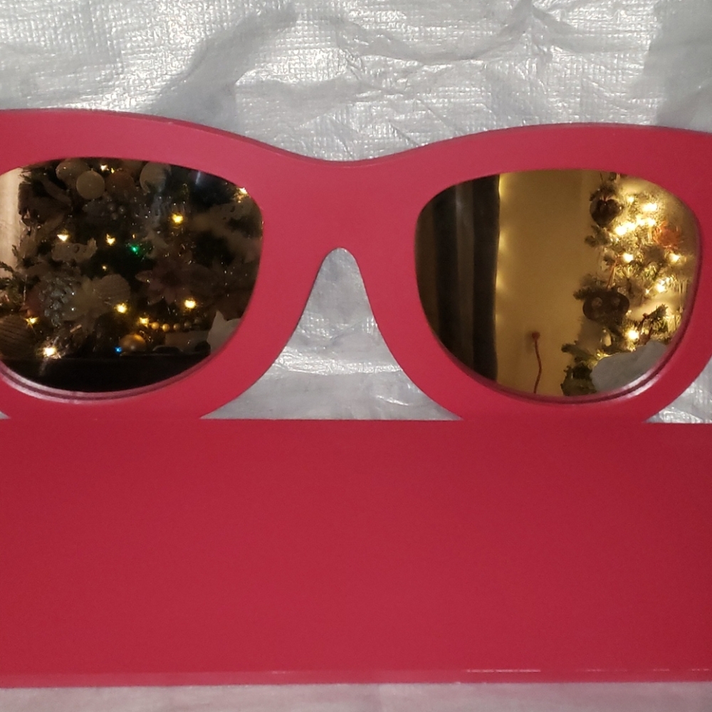 Pink sunglass shelf